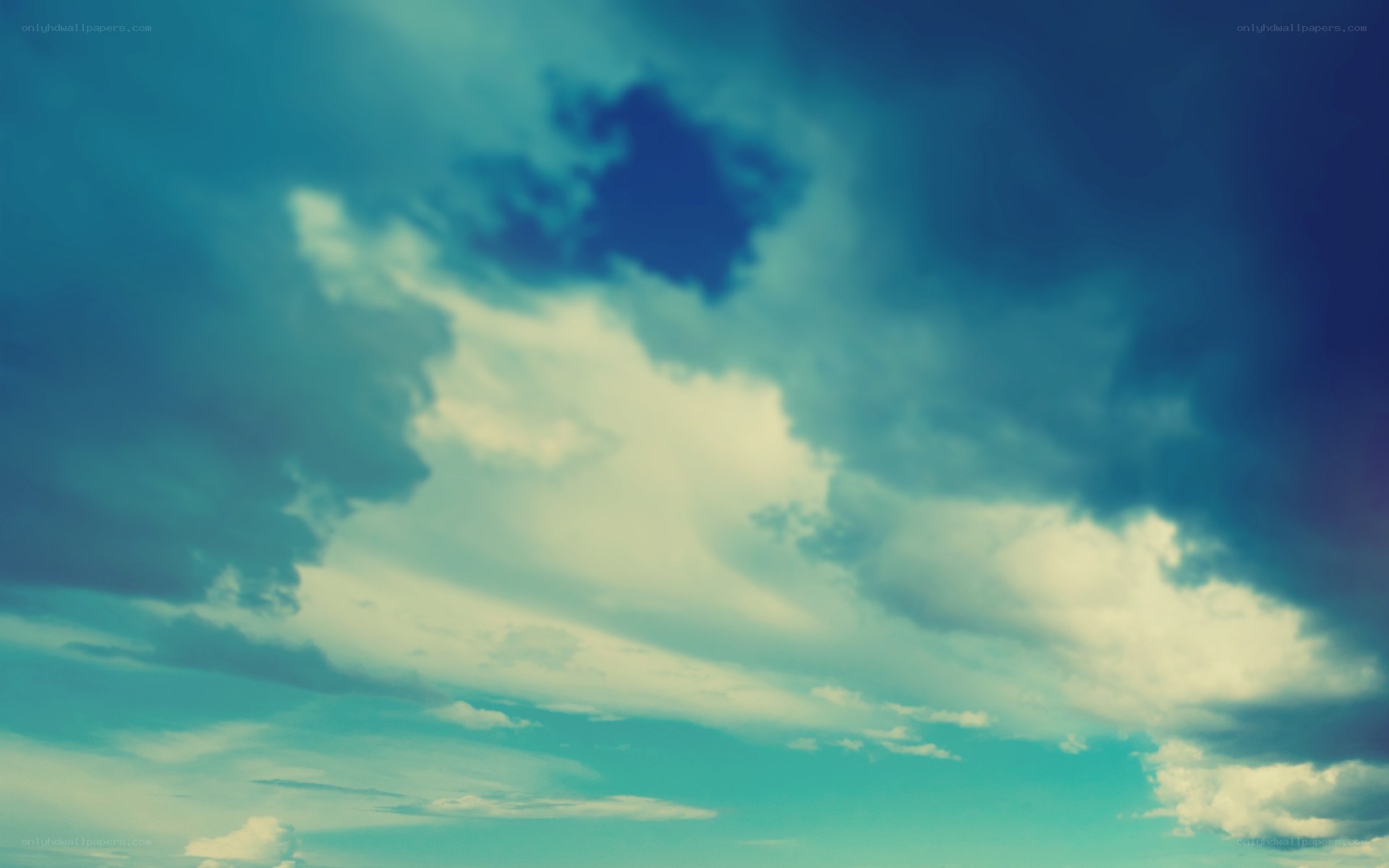 Clouds in a teal sky