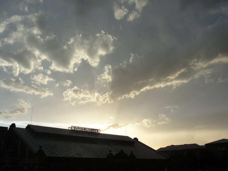 clouds over a building at sunset
