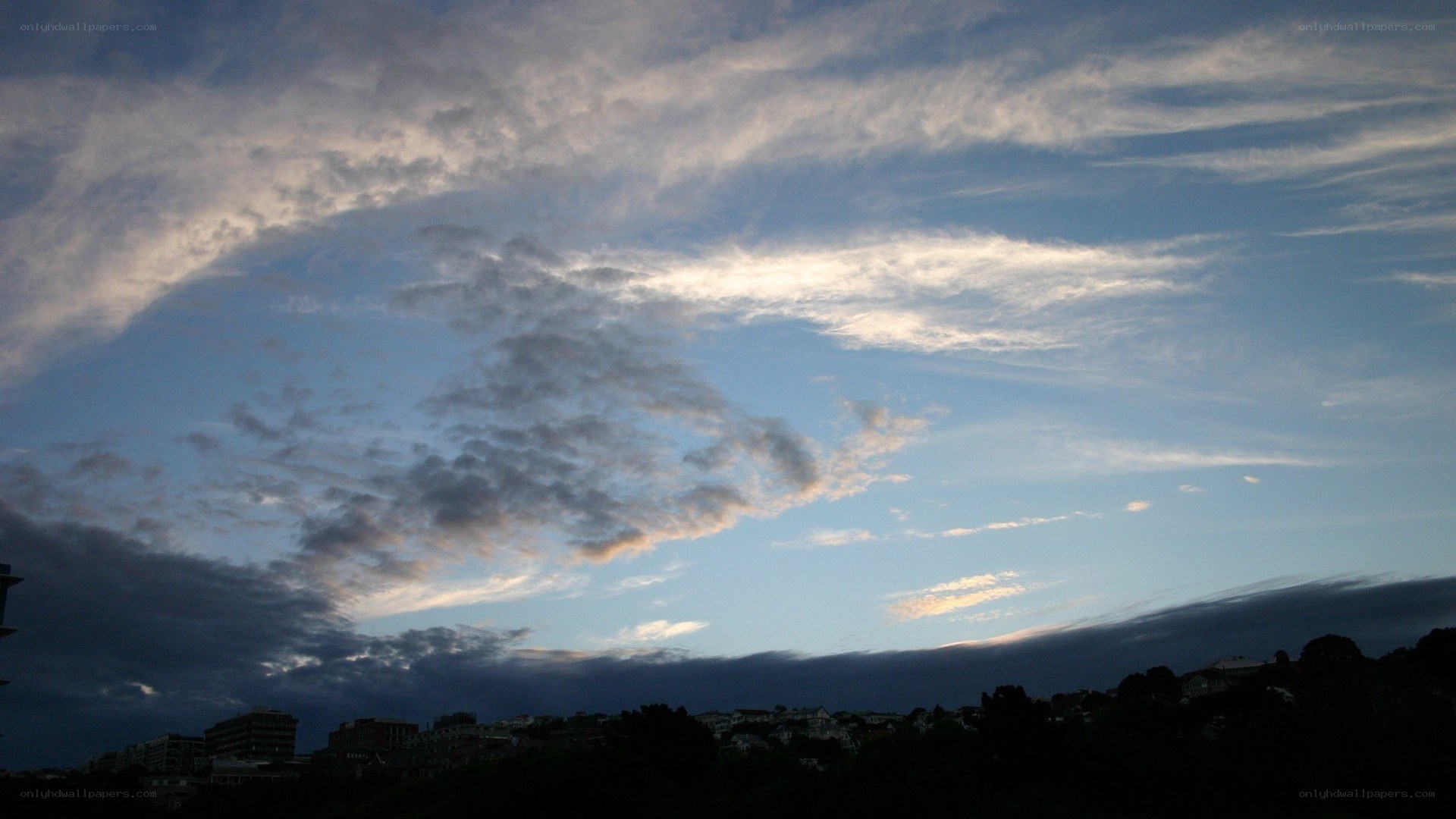 clouds over a city skyline