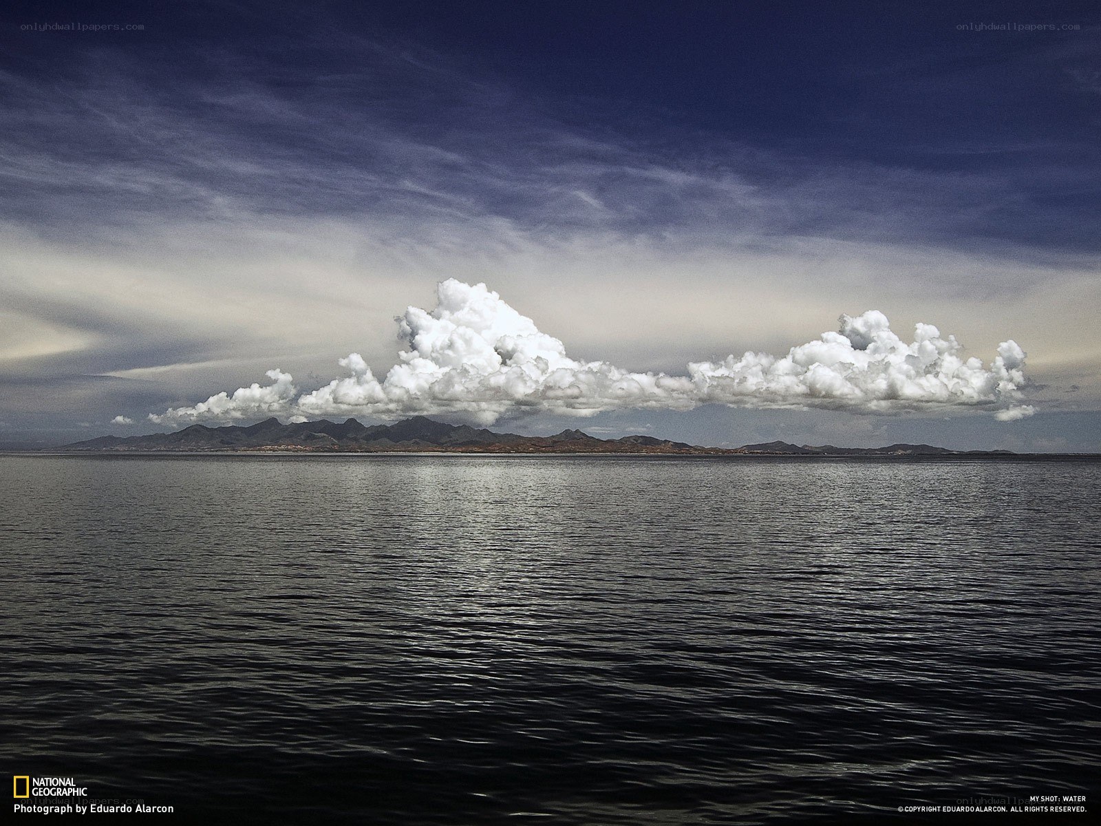 Clouds over a distant island