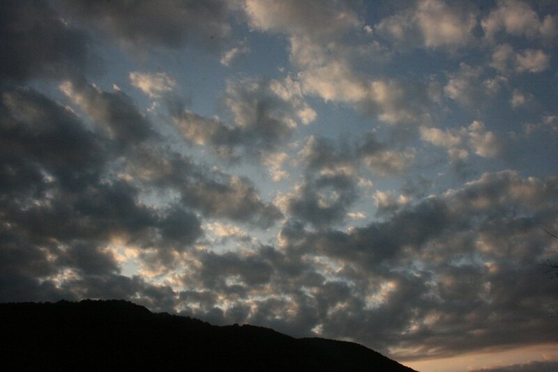 clouds over a mountain silhouette