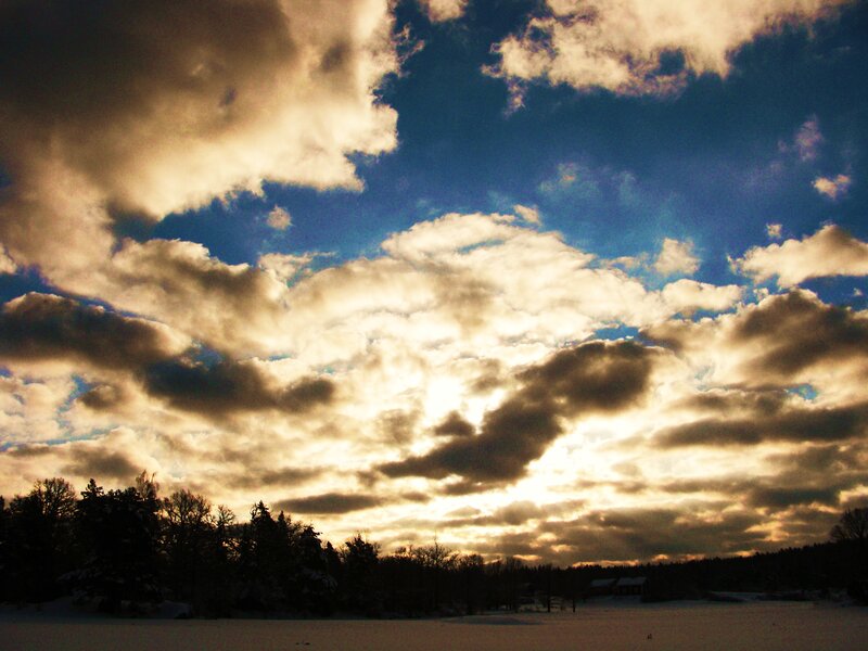 Clouds over a snowy landscape