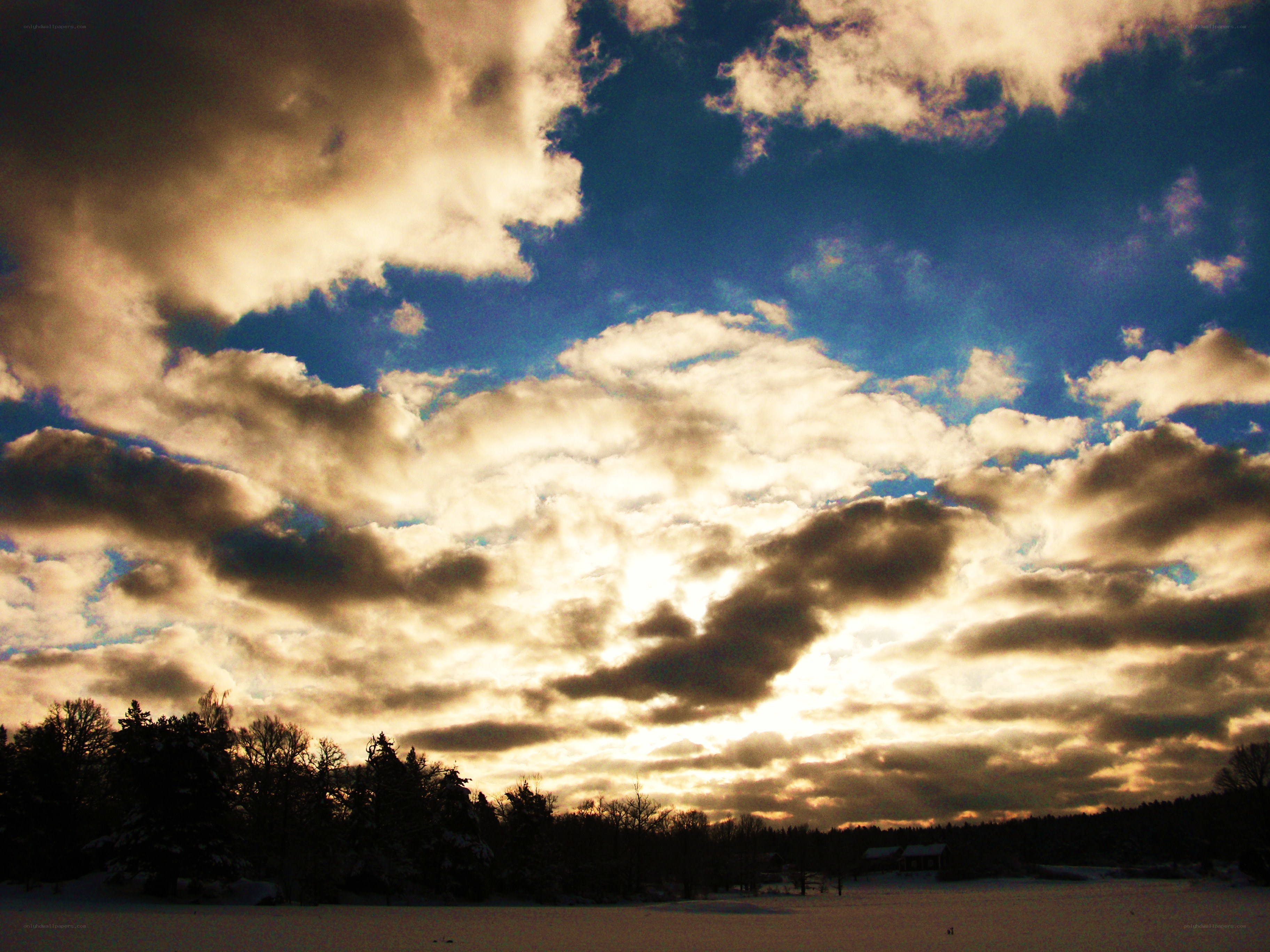 Clouds over a snowy landscape