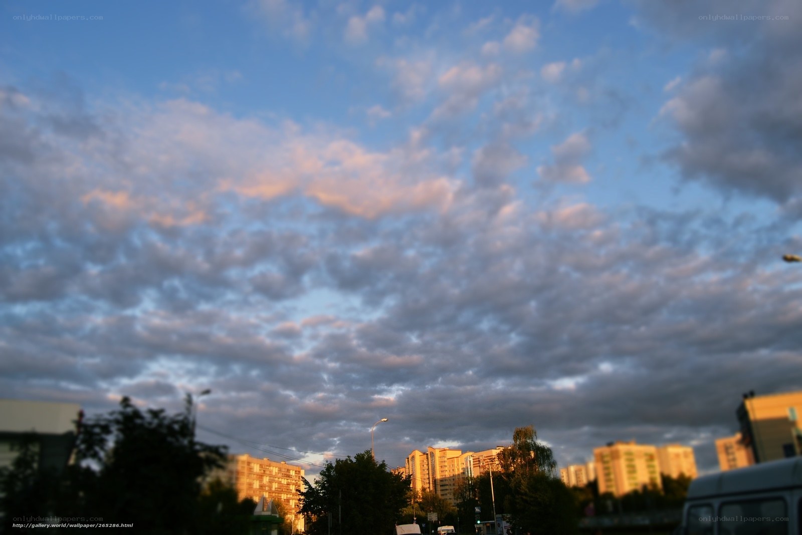 Clouds over city at sunset
