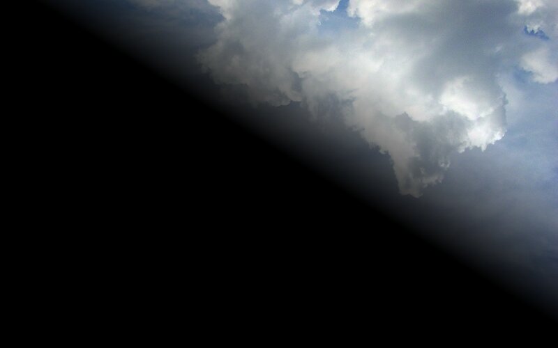 clouds over dark sky