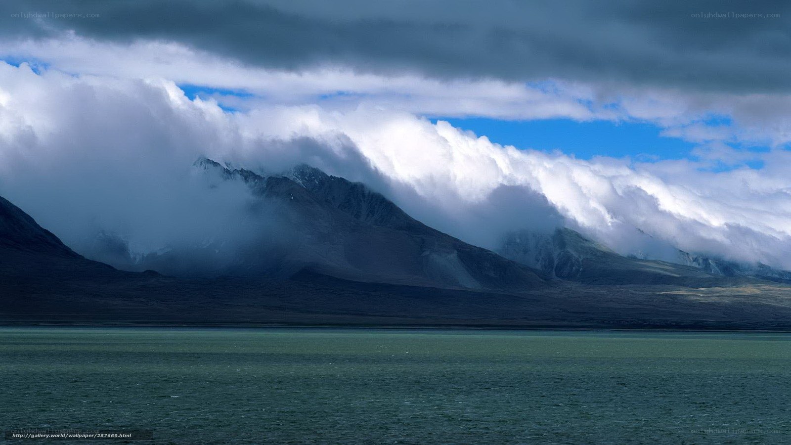 Clouds over mountain lake