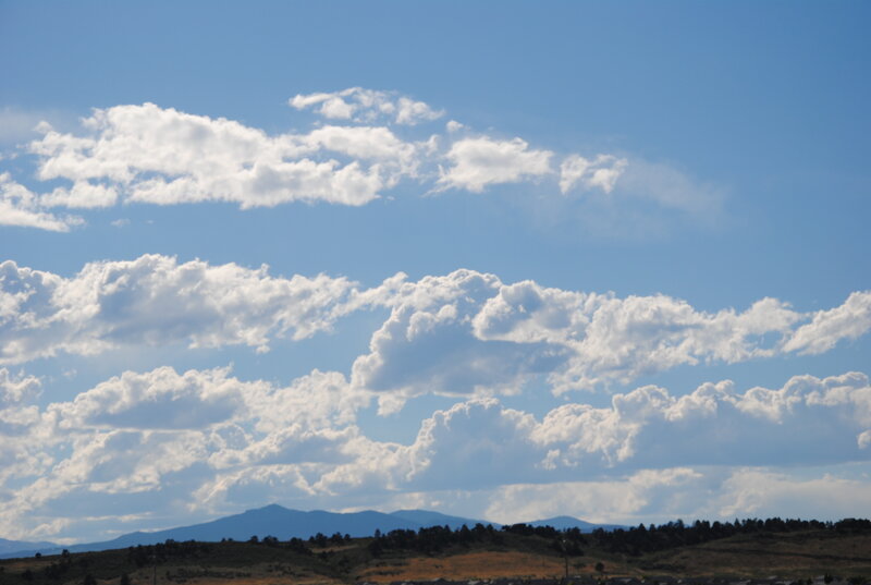 Clouds over mountain landscape