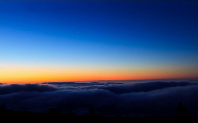 Clouds over Mountain Peak — Blue