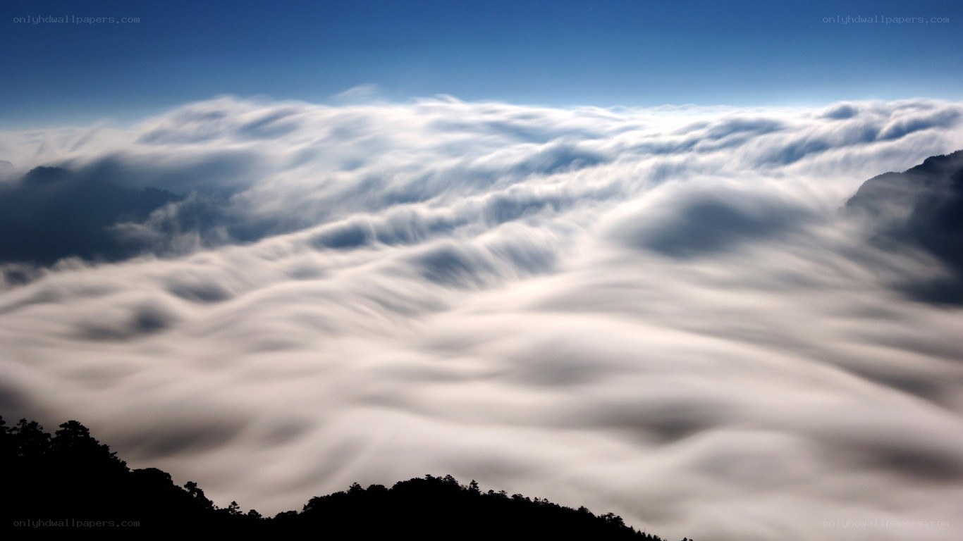 Clouds over mountain peaks