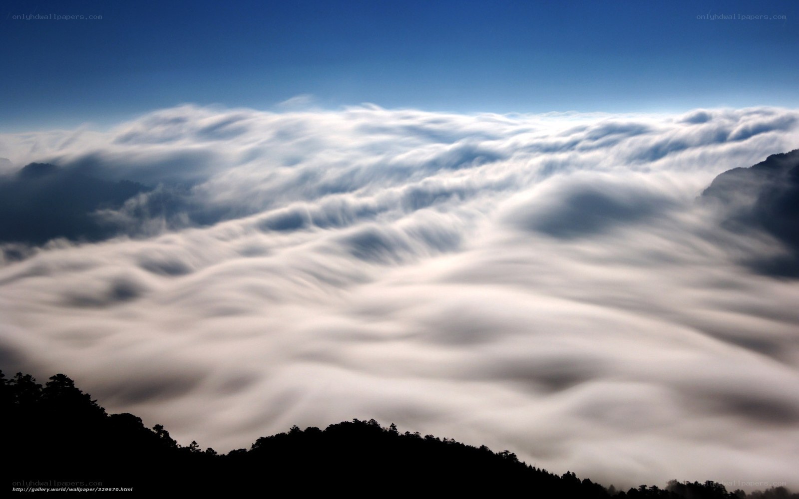 Clouds over mountain peaks
