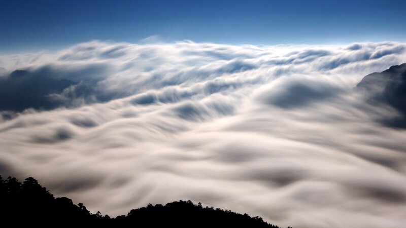 Clouds over Mountain Peaks — Blue, Serene, Morning