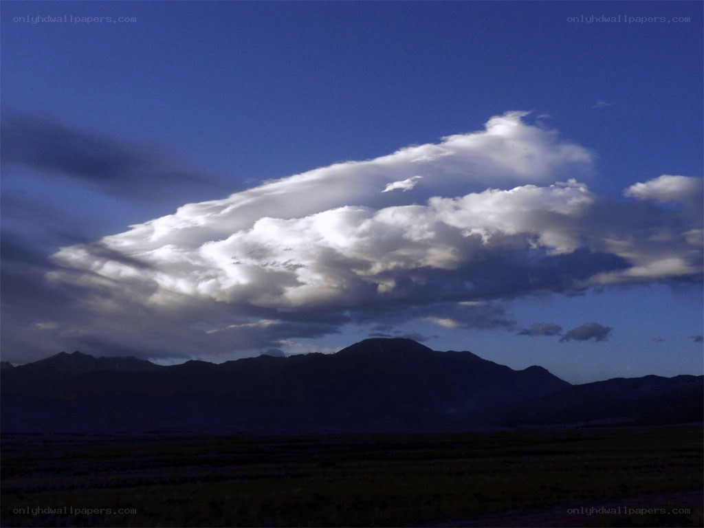 Clouds over mountain range