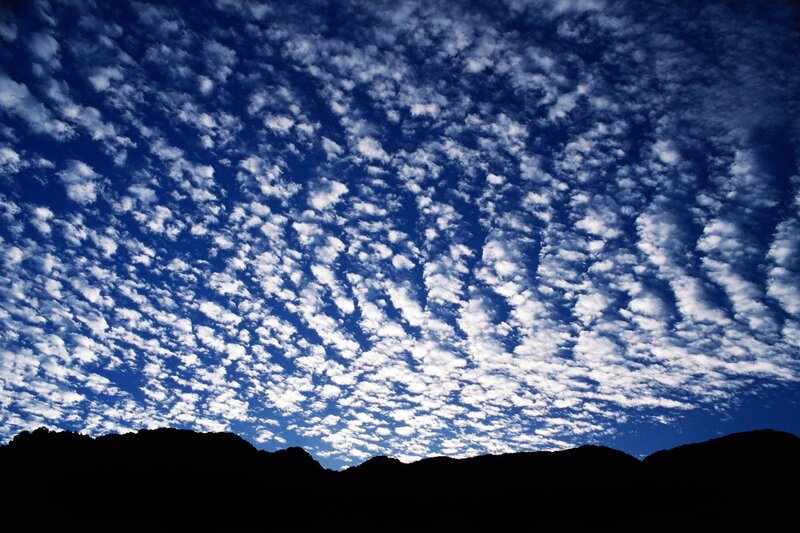 Clouds over mountain silhouette