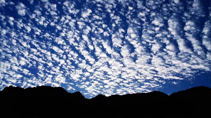 clouds over mountain silhouette