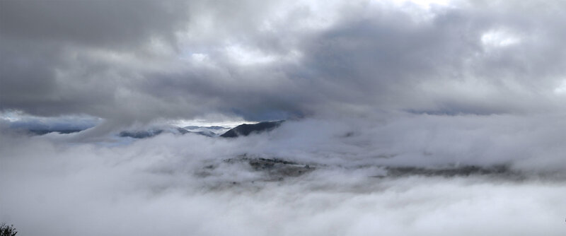 clouds over mountain valley