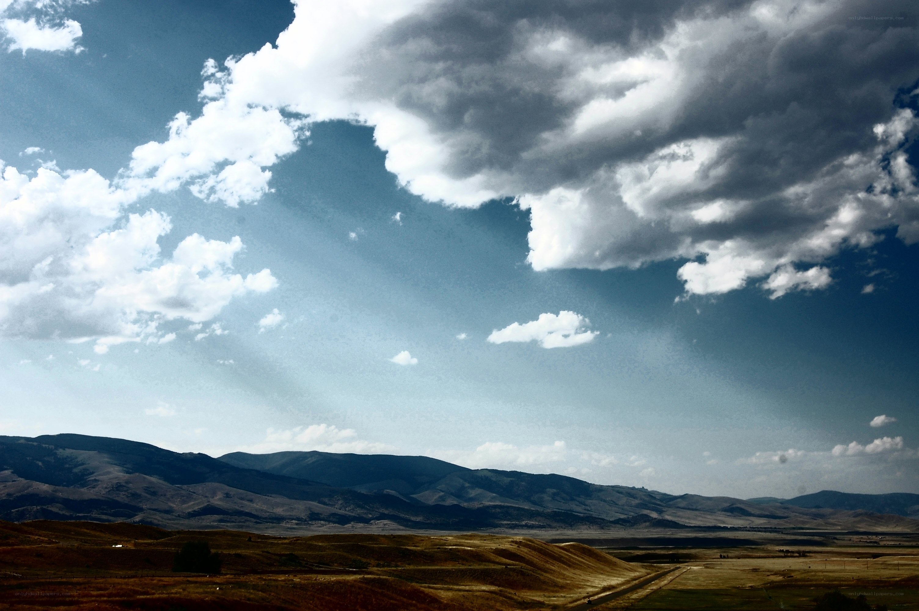 Clouds over mountainous landscape