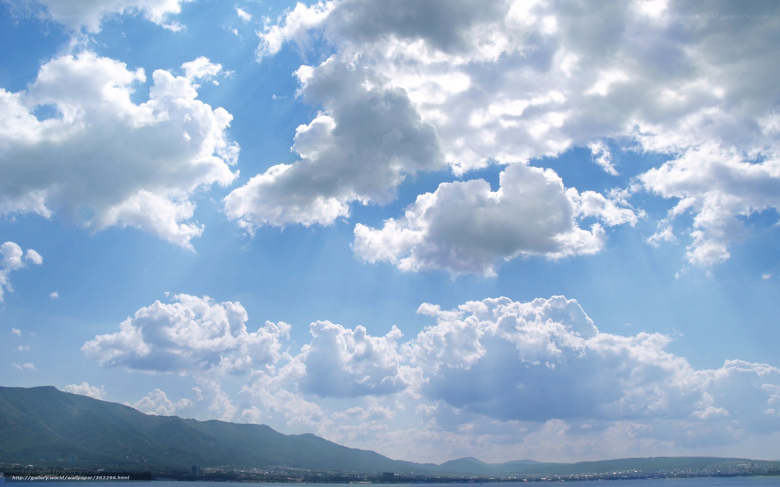Clouds over mountains and sea