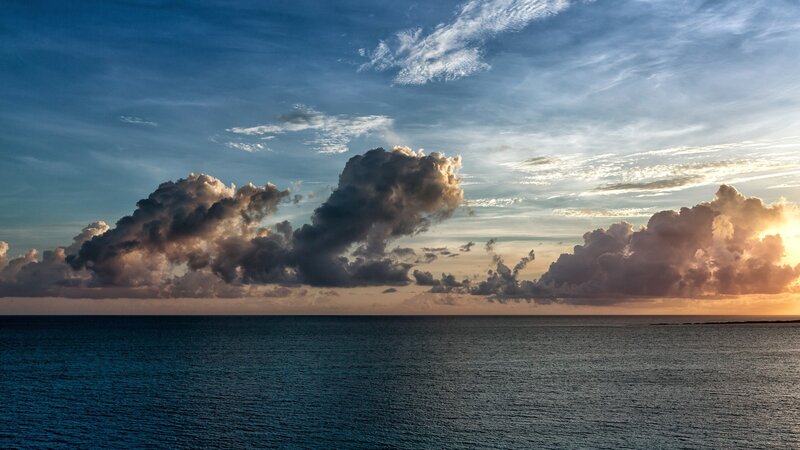 Clouds over Ocean at Sunset — Blue