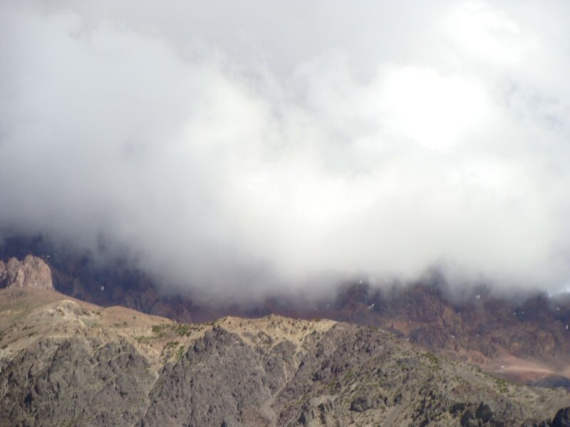 clouds over rocky mountains