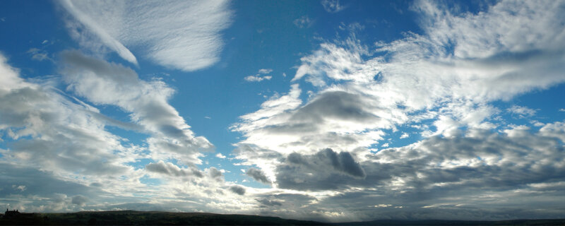 Clouds over rolling hills