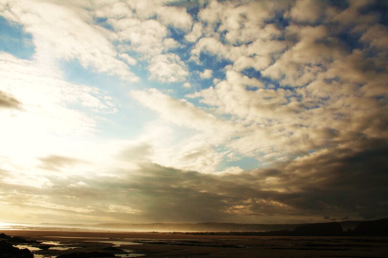 Clouds over the beach at sunset
