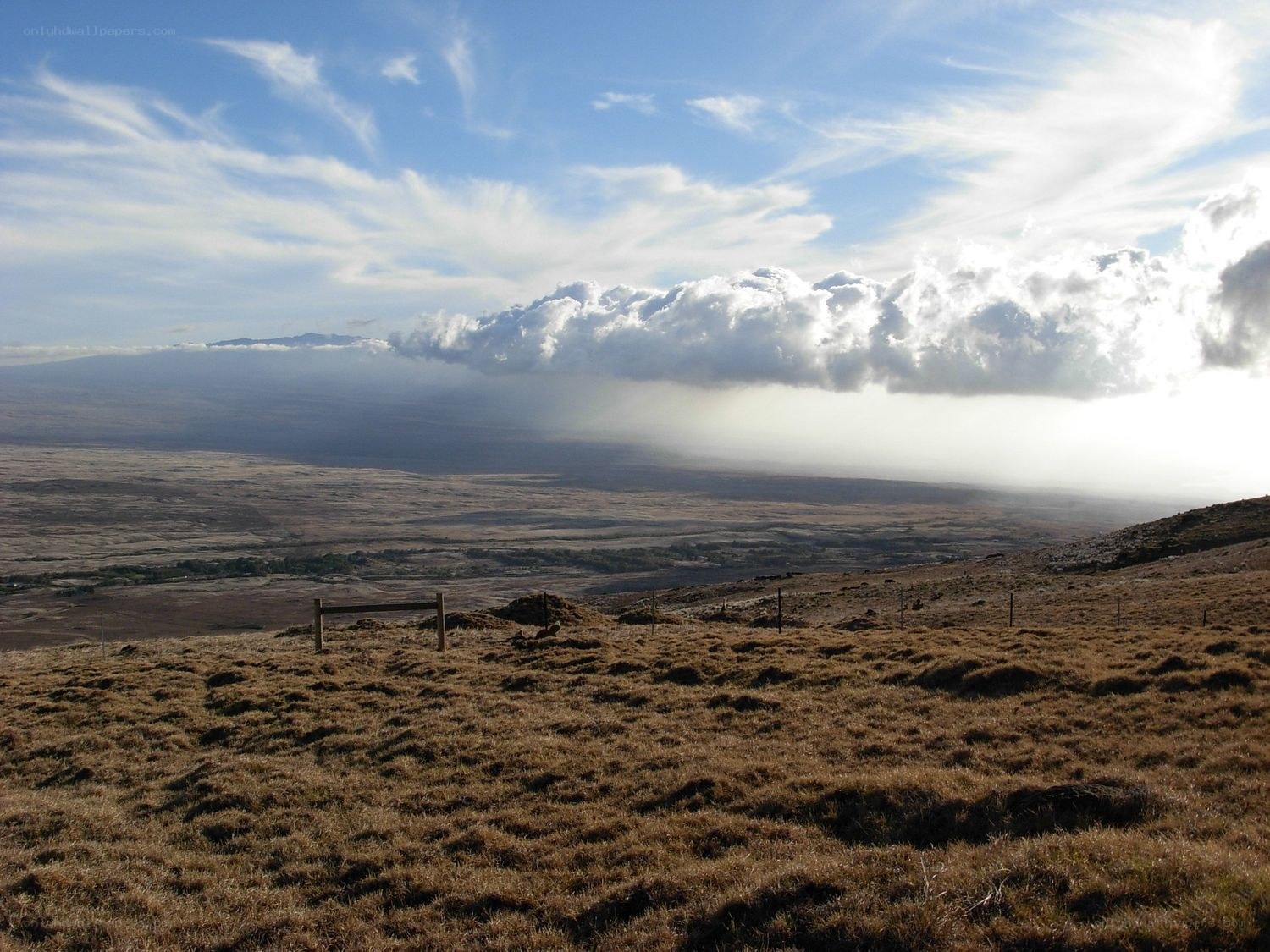 Clouds over volcanic landscape