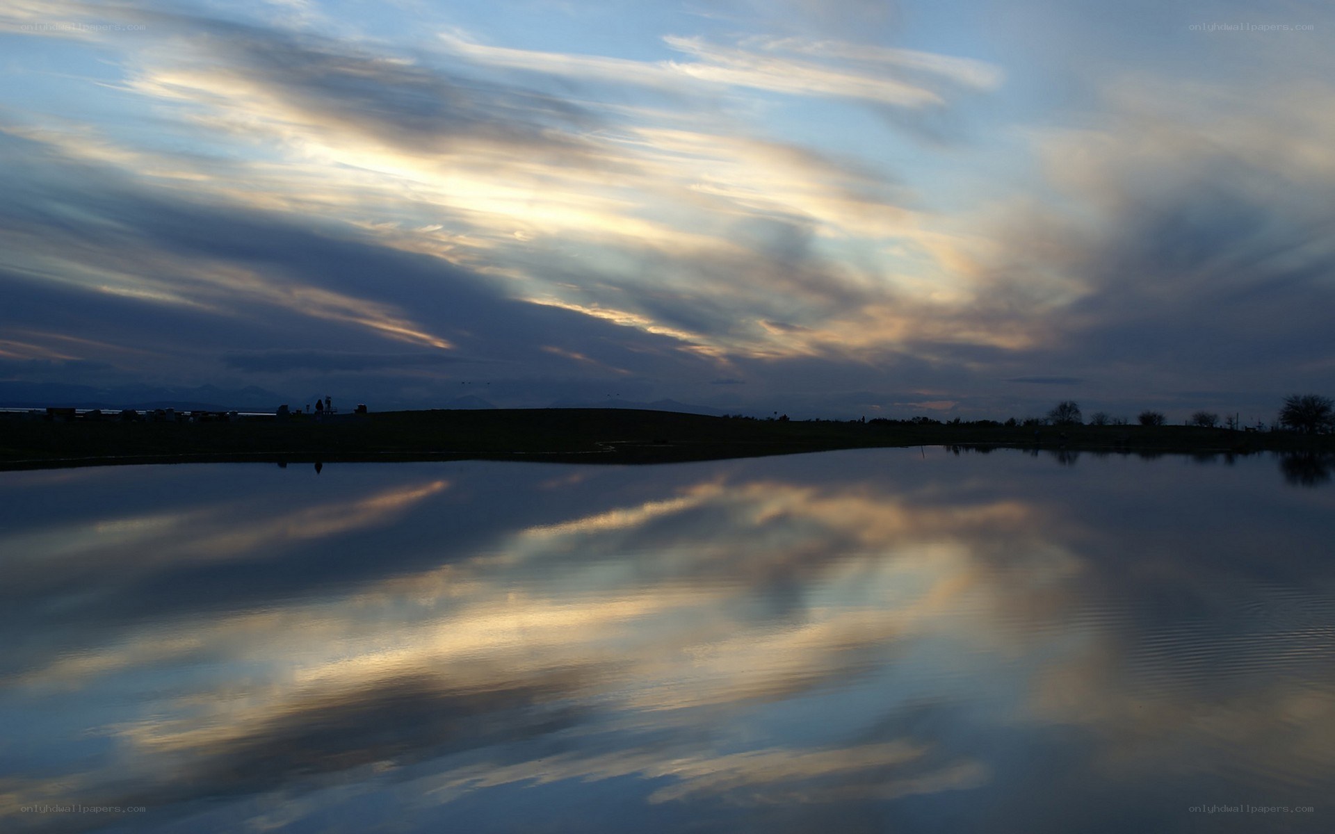 Clouds reflected in a calm lake
