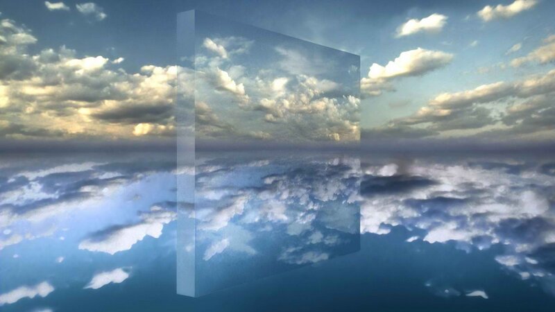 clouds reflected in a glass panel