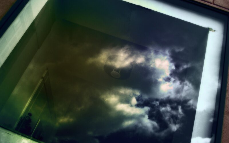 Clouds reflected in a skylight