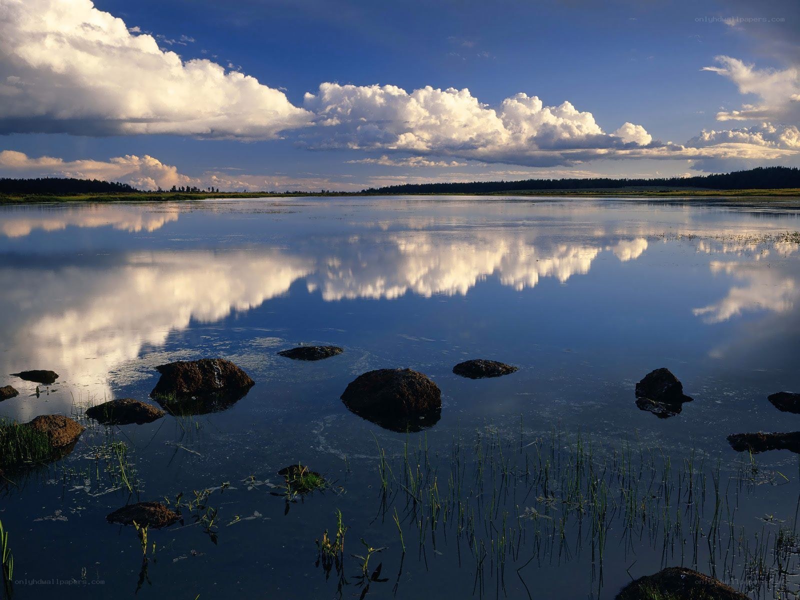 Clouds reflected in calm lake