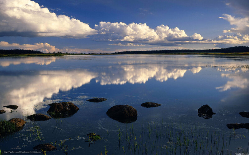 Clouds reflected in calm lake