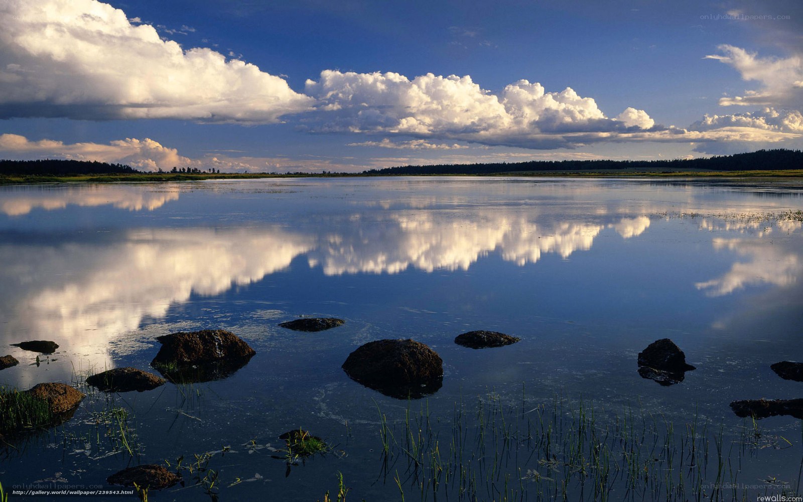 Clouds reflected in calm lake