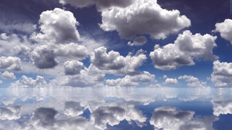 Clouds reflected in calm water