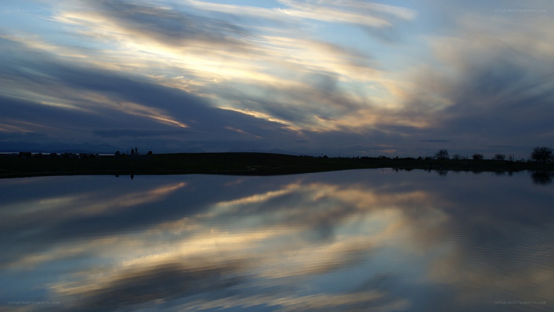 Clouds reflected in calm water