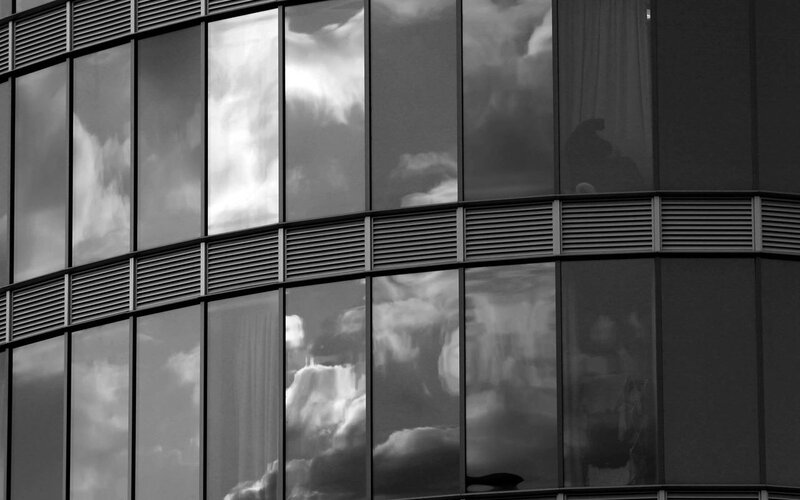 Clouds reflected in glass facade