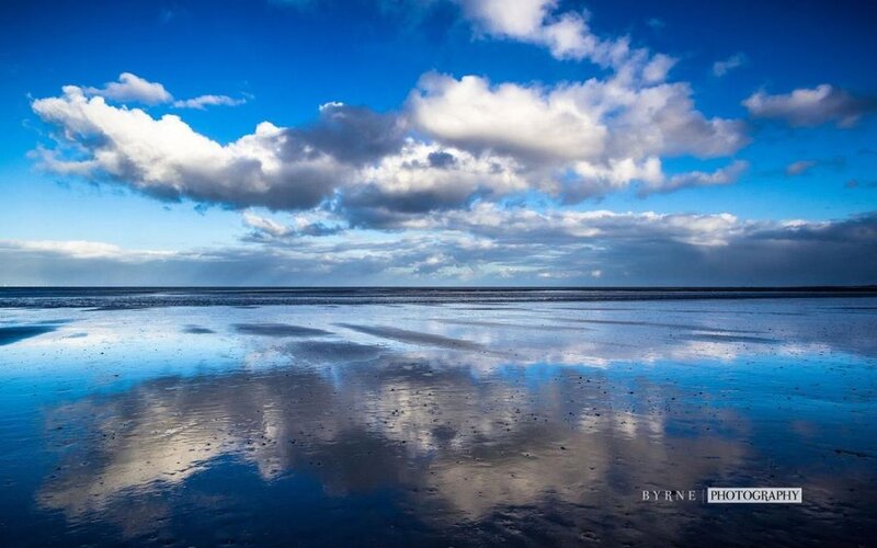 Clouds Reflected in Wet Sand