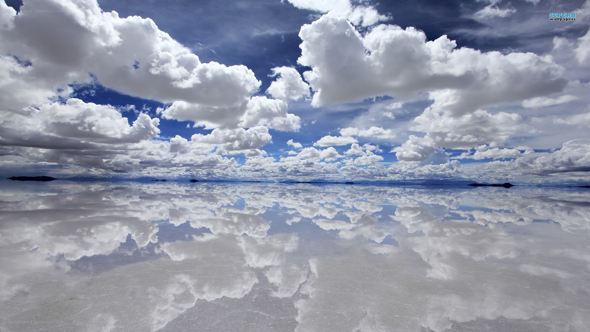 Clouds reflected on salt flat