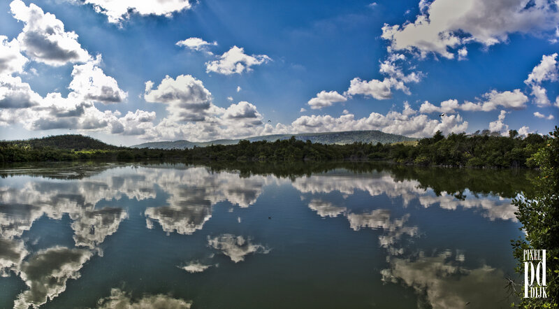Clouds Reflecting in Lake — Blue, Serene