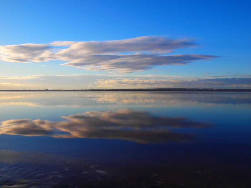 Clouds Reflecting in Water — Blue, Serene, Sunset