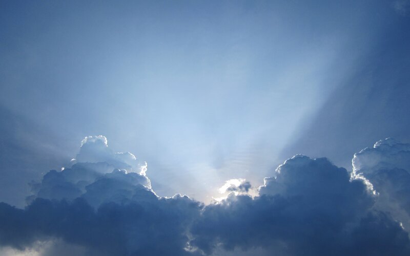 Clouds with Sun Rays — Blue