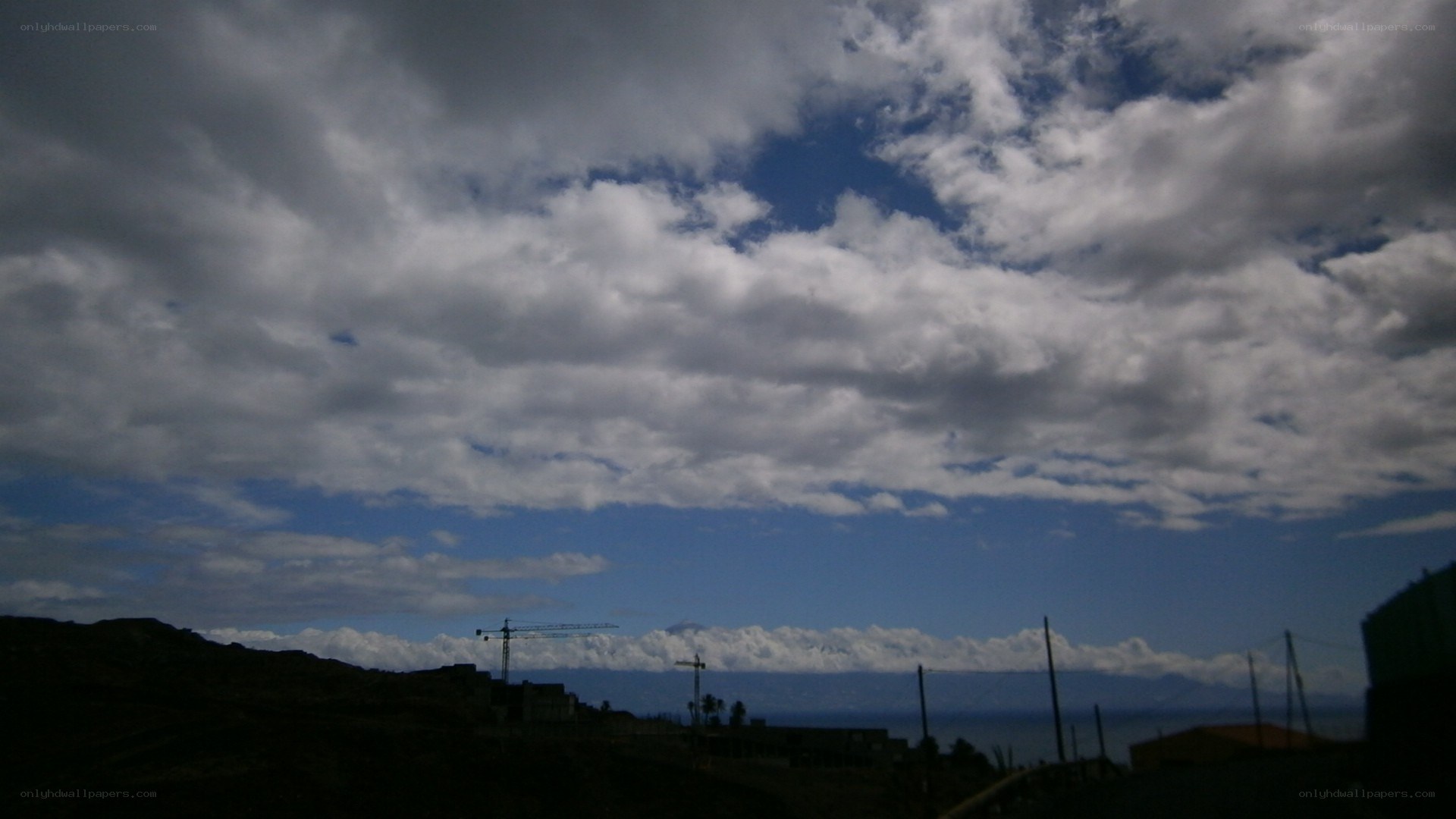 Cloudy sky over coastal town