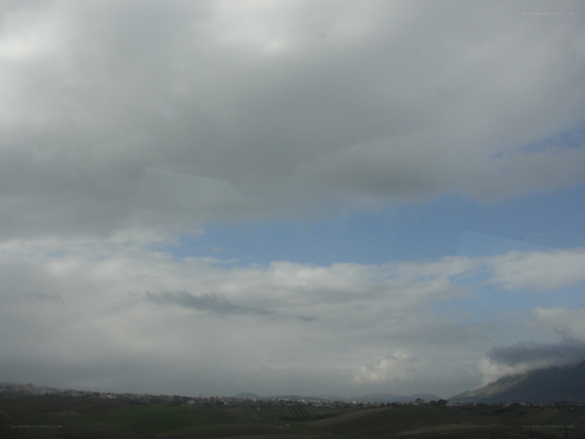 cloudy sky over hills