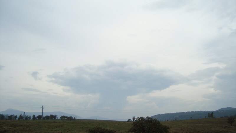 Cloudy Sky over Hills — Gray, Overcast, Photograph