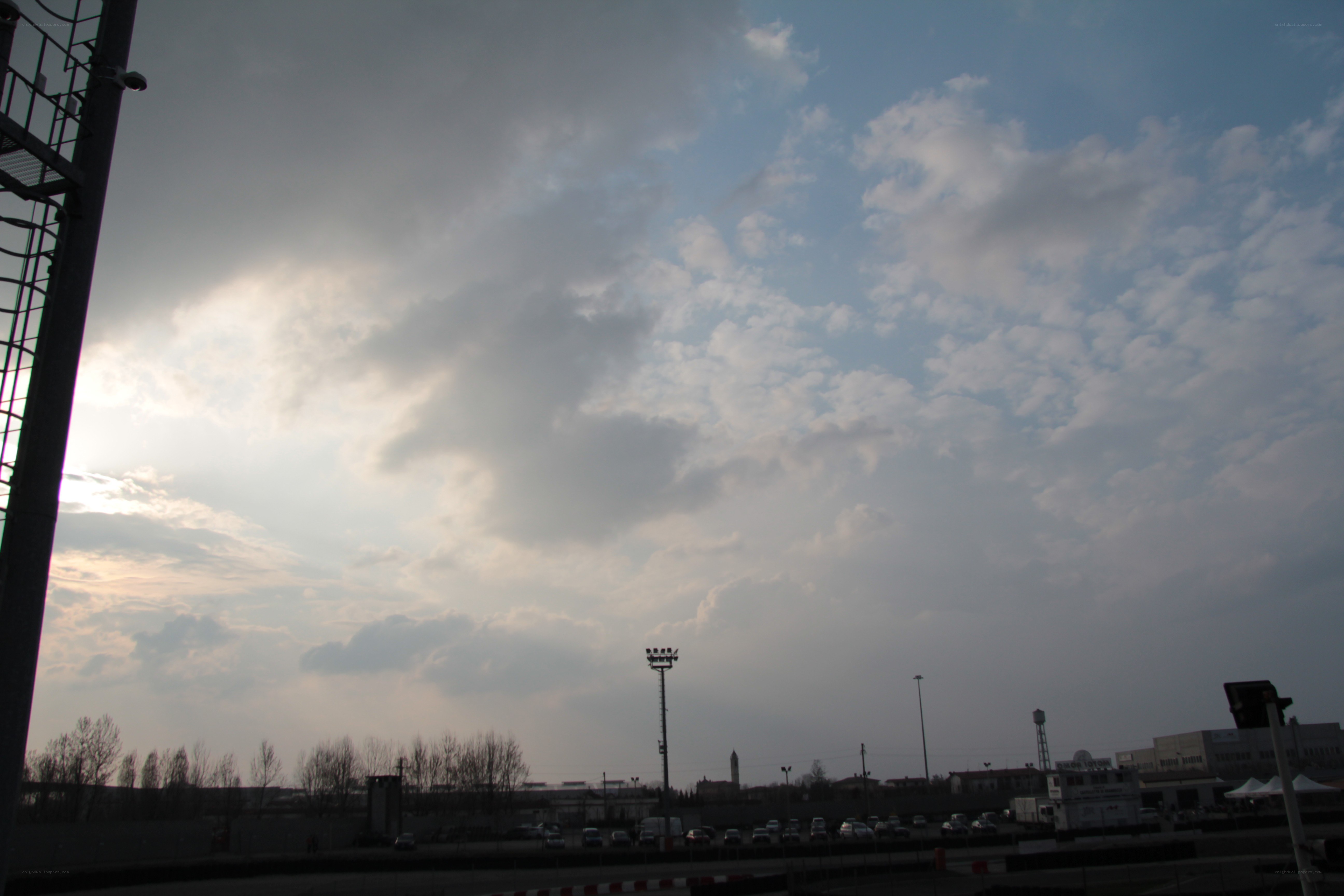 cloudy sky over industrial area