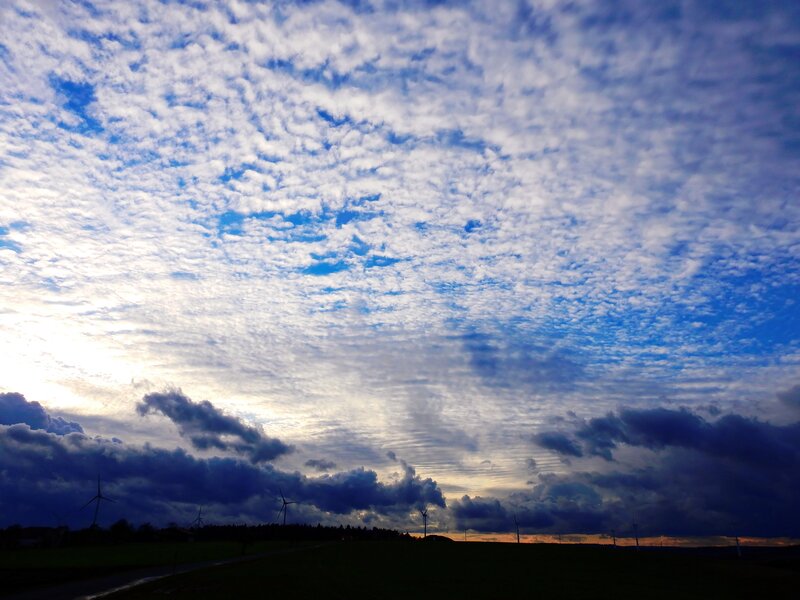 Cloudy sky over wind turbines
