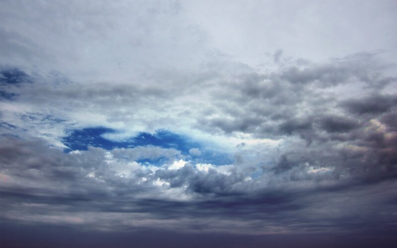 cloudy sky with blue patch