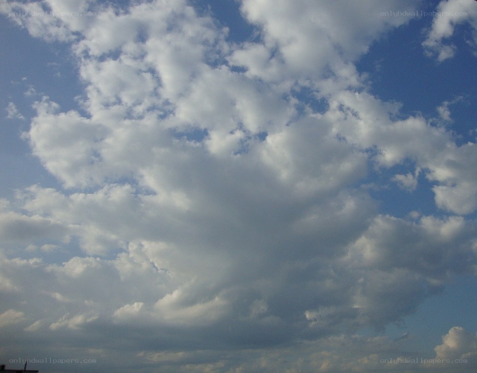 Cloudy sky with blue patches