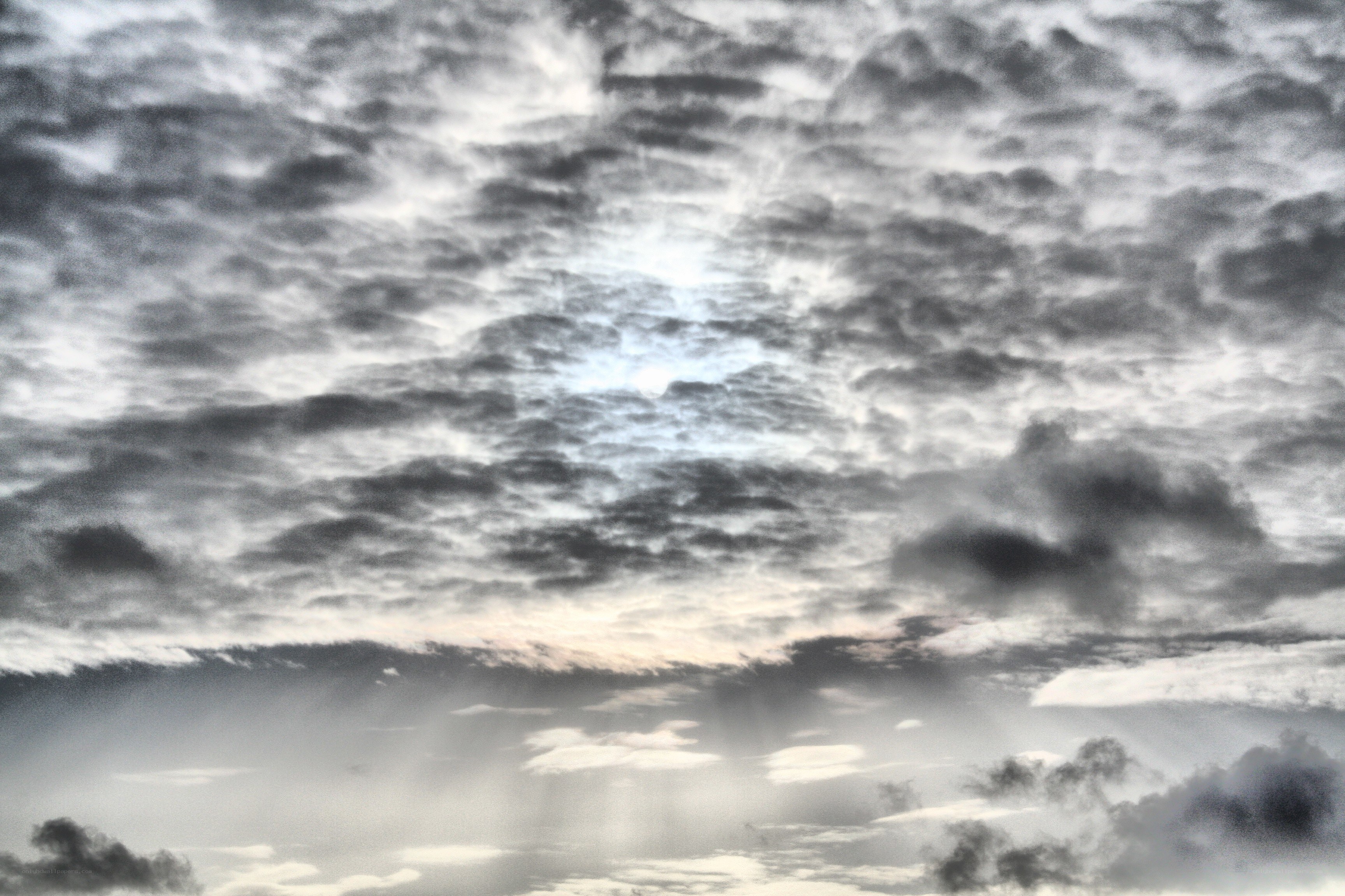 Cloudy sky with sun rays