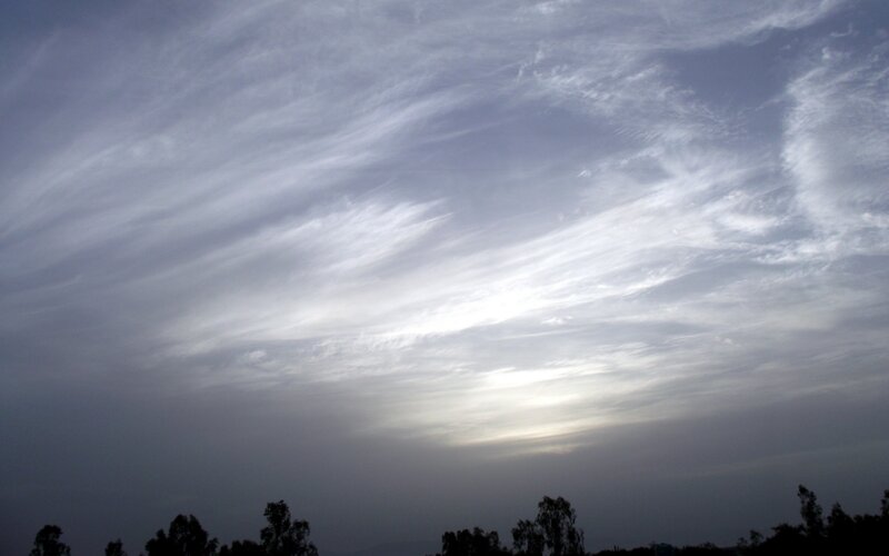 Cloudy sky with sunlit clouds