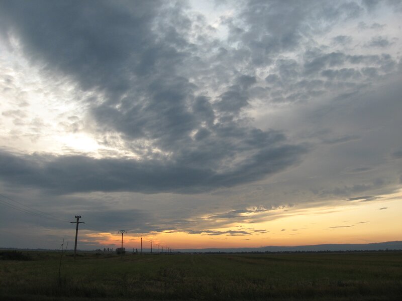 cloudy sunset over fields